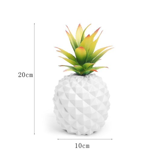 white pineapple plant and green plant office desk decoration