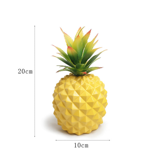 Yellow pineapple plant and green plant office desk decoration